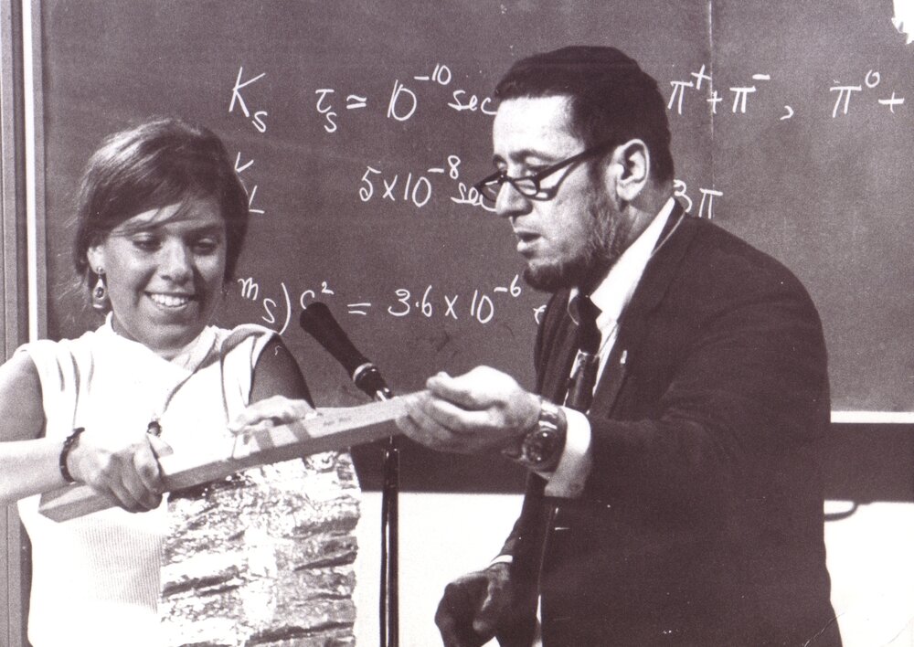 Student Demonstrating to Professor Harry Messel at International Science School for High School Students