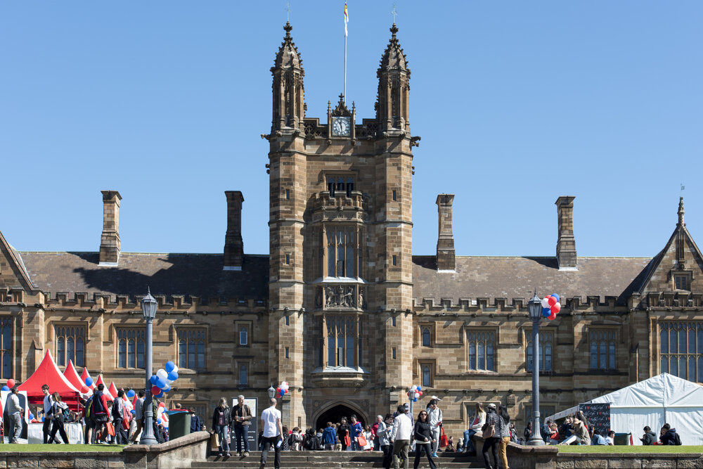 View of Quadrangle and Clocktower with Open Day Activities on Front Lawn