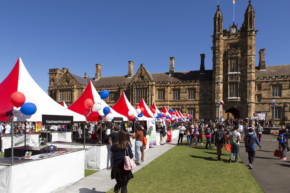Toastmasters Society and Effective Altruism Stalls on Front Lawn at Open Day