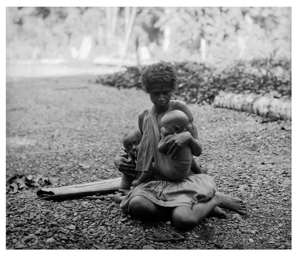 Woman Suckling Two of Her Children at Once