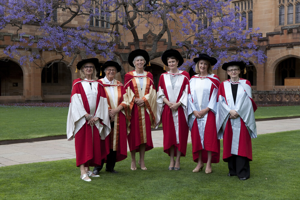 Honorary Award Holders at Quadrangle in Front of Jacaranda in Bloom