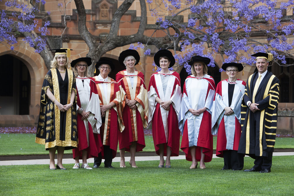 Honorary Award Holders at Quadrangle in Front of Jacaranda in Bloom