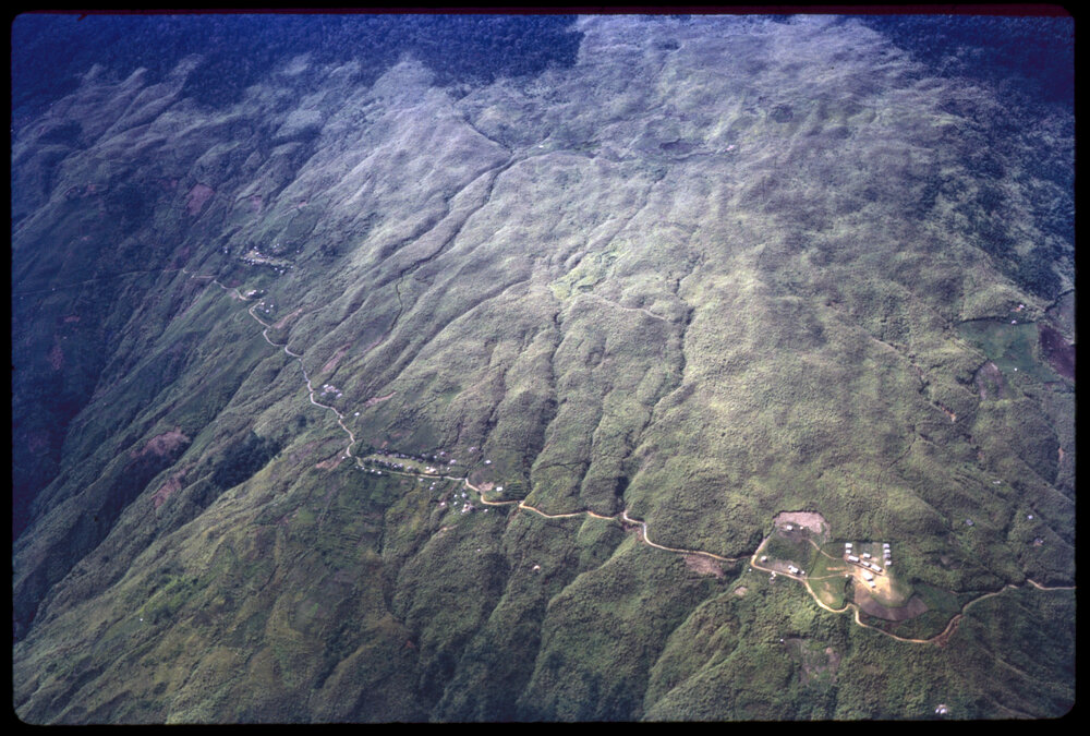 Aerial View of Mountain and Village