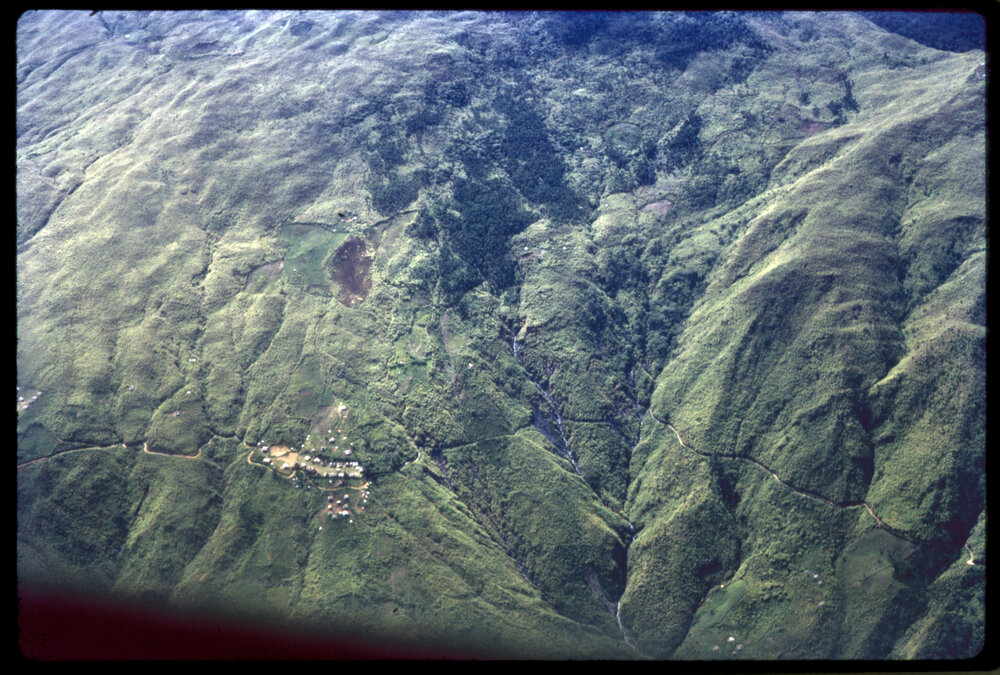 Aerial View of Mountain and Village
