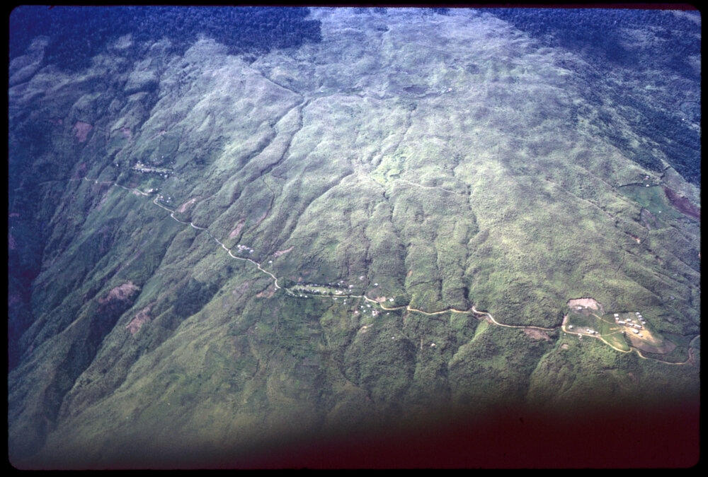 Aerial View of Mountain and Village