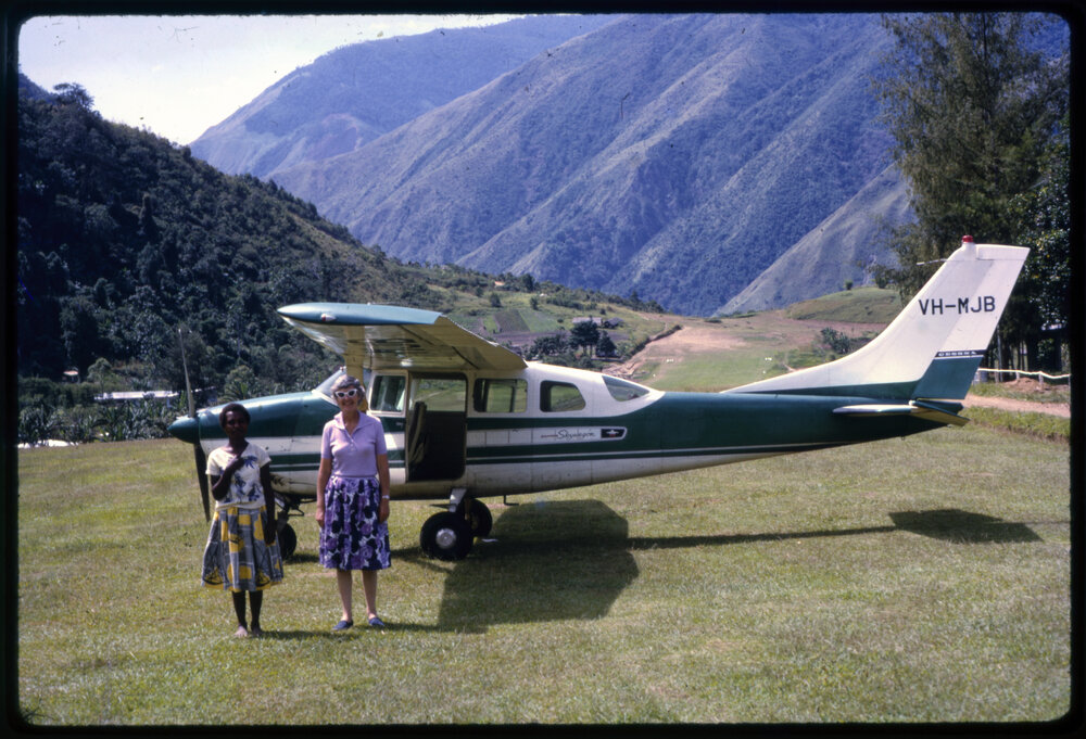 Margaret McArthur and Unidentified Woman in front of Plane