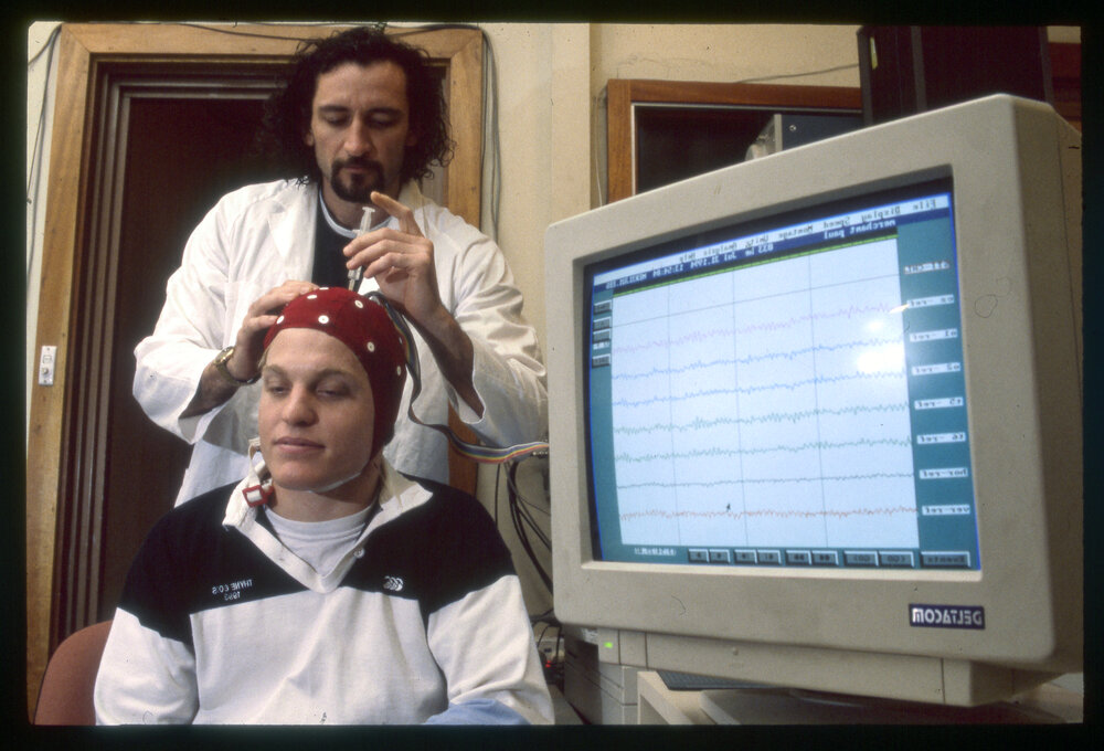 Student Measuring Brain Waves of Another Student 