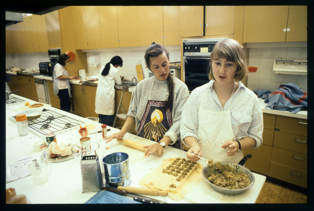 Education Home Economics Class Students Preparing Food in the Kitchen