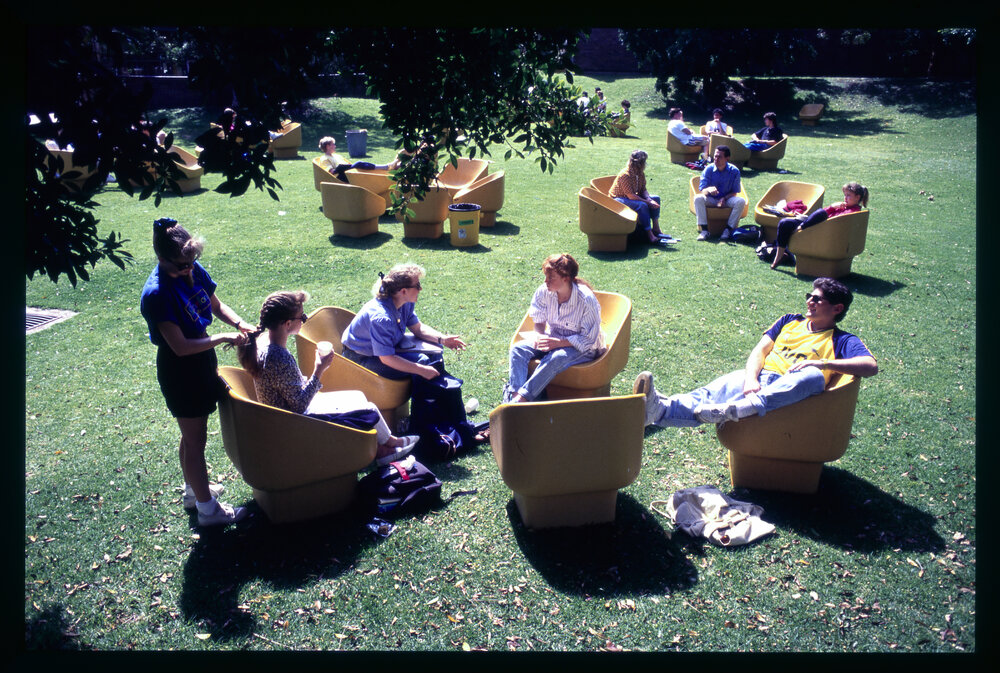 Students in Outdoor Arm Chairs on Cumberland Campus Lawn
