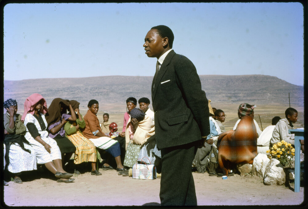 Man Talking to Seated Group