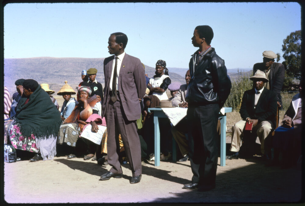 Group of People with Mountains in Distance
