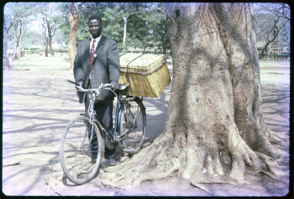 Man Standing with Bicycle