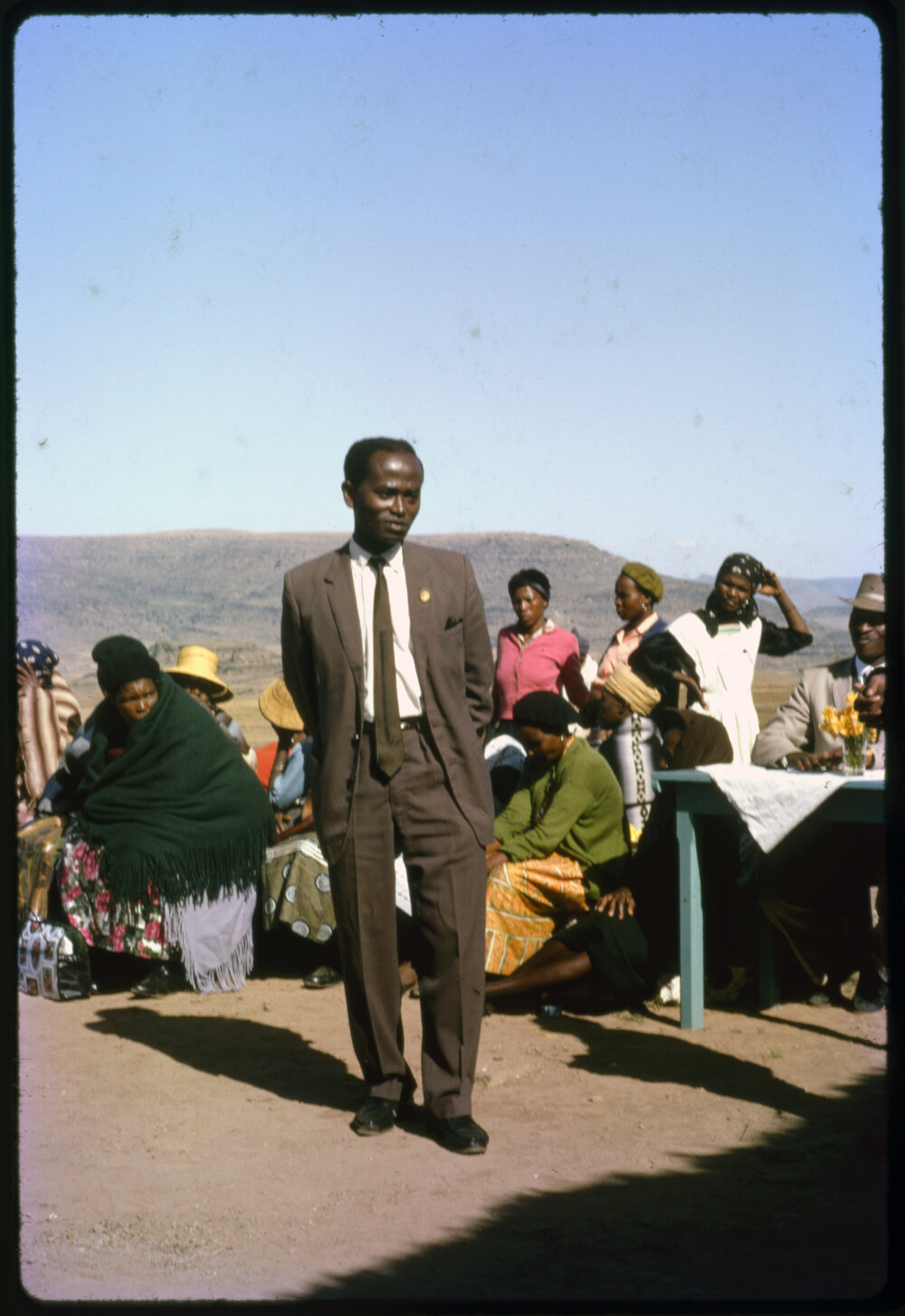 Group of People with Mountains in Distance