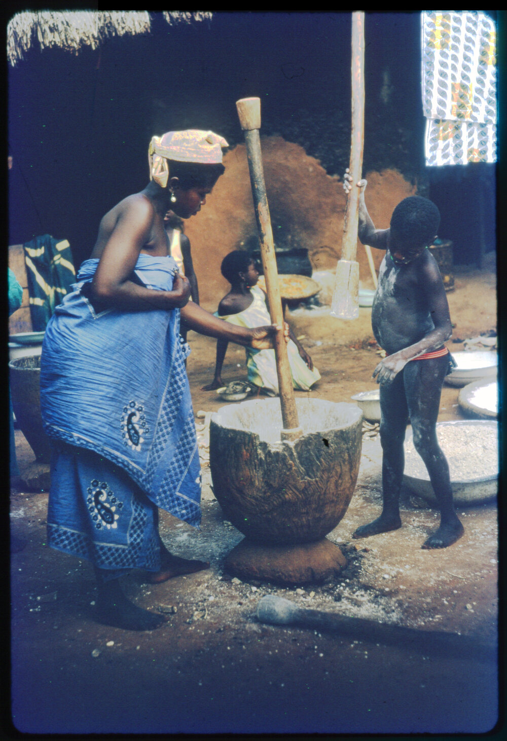 Woman and Boy Using Mortar and Pestle