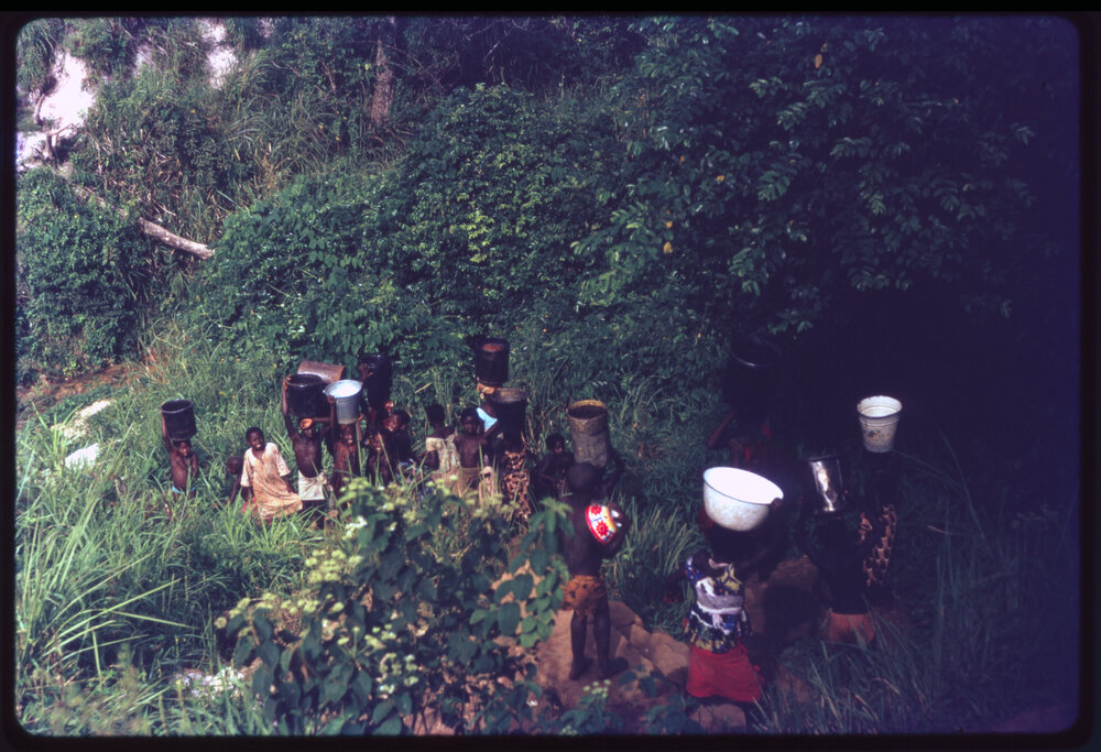 Group of Children Carrying Buckets