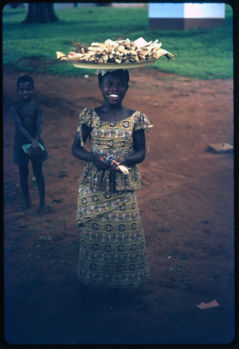 Girl Carrying Tray on her Head