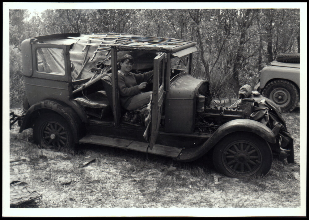 Jan Jacobs Sitting in Wrecked Car