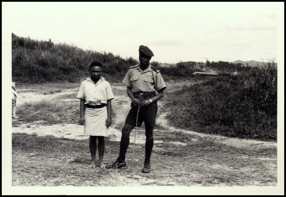Eba, a Local Interpreter and Tororano, a Policeman