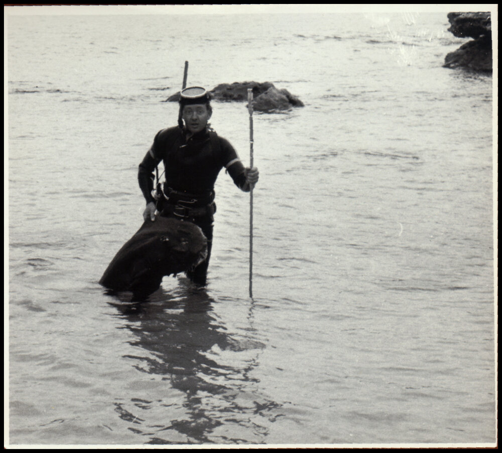 John Thompson Holding a Speared Fish