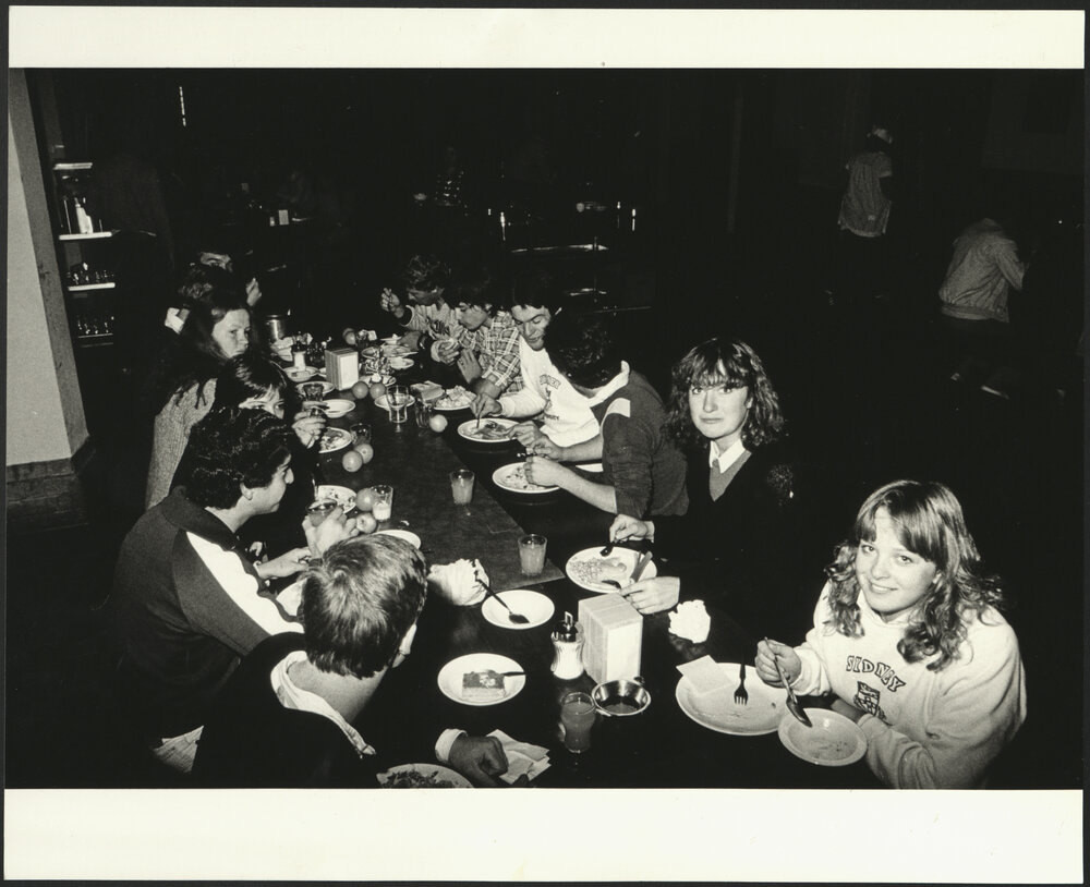 Male and Female Students at Evening Dinner at College