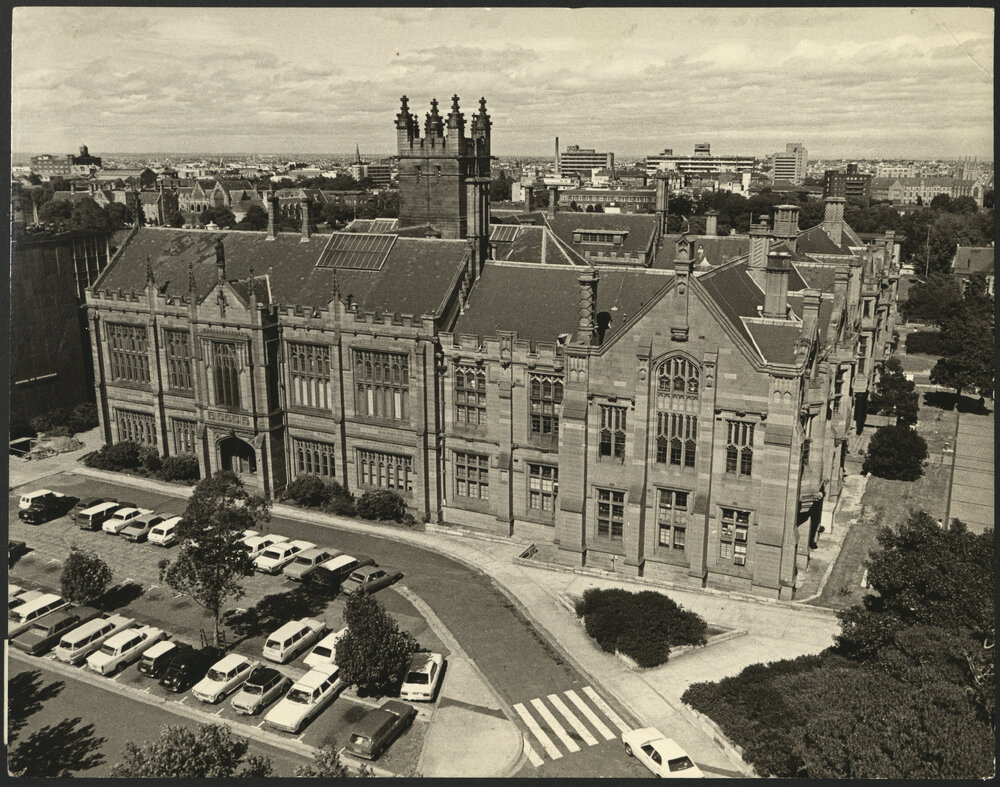 Elevated View of Anderson Stuart Building with Car Park in Front of Building
