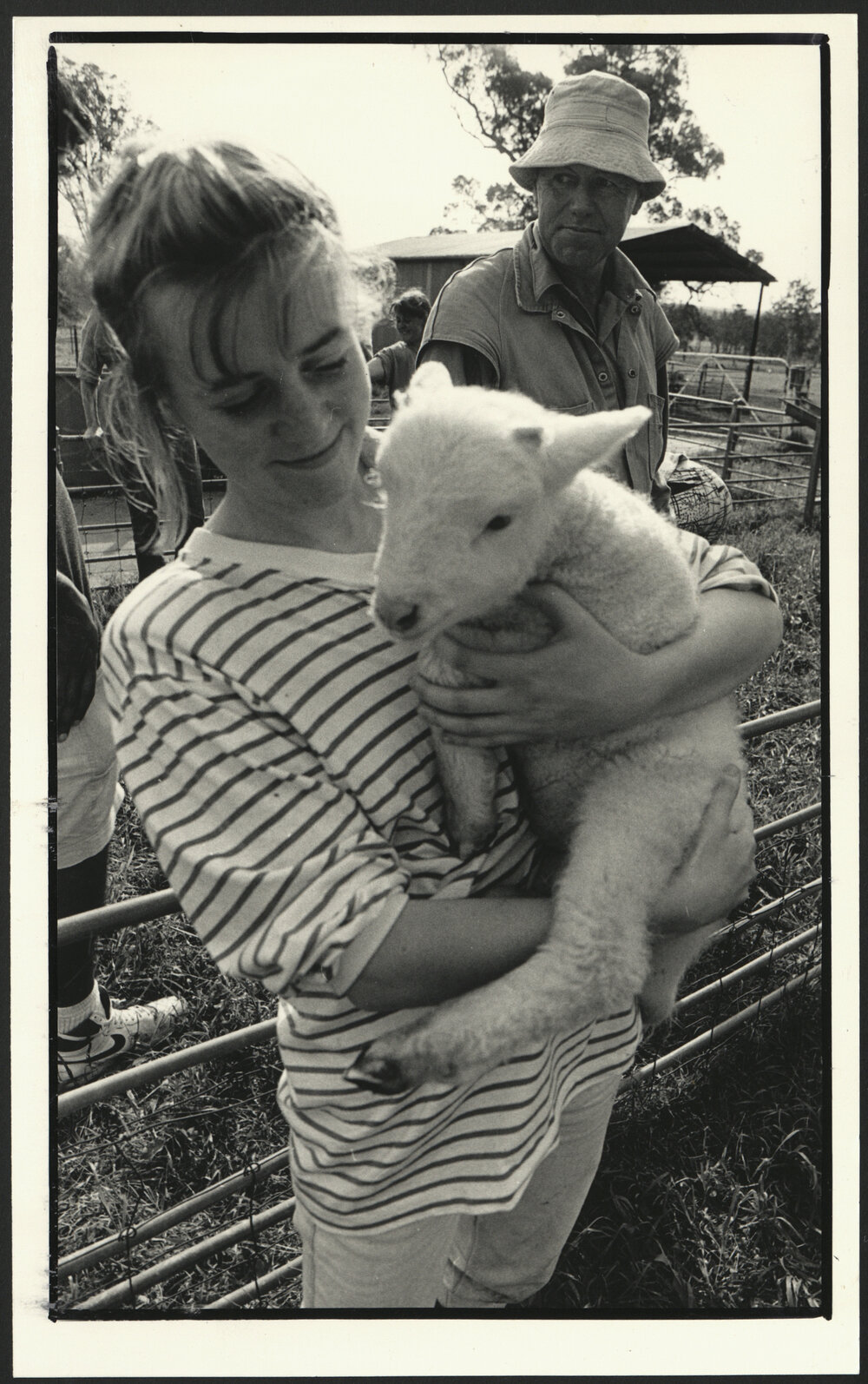 A Veterinary Student Holding a Lamb at the Research Centre in Camden