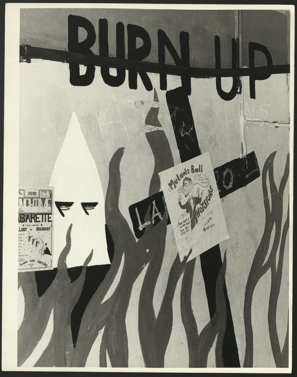 Close-Up of Graffiti in Graffiti Tunnel Entitled 'Burn UP' and Two Posters Stuck to the Wall                  