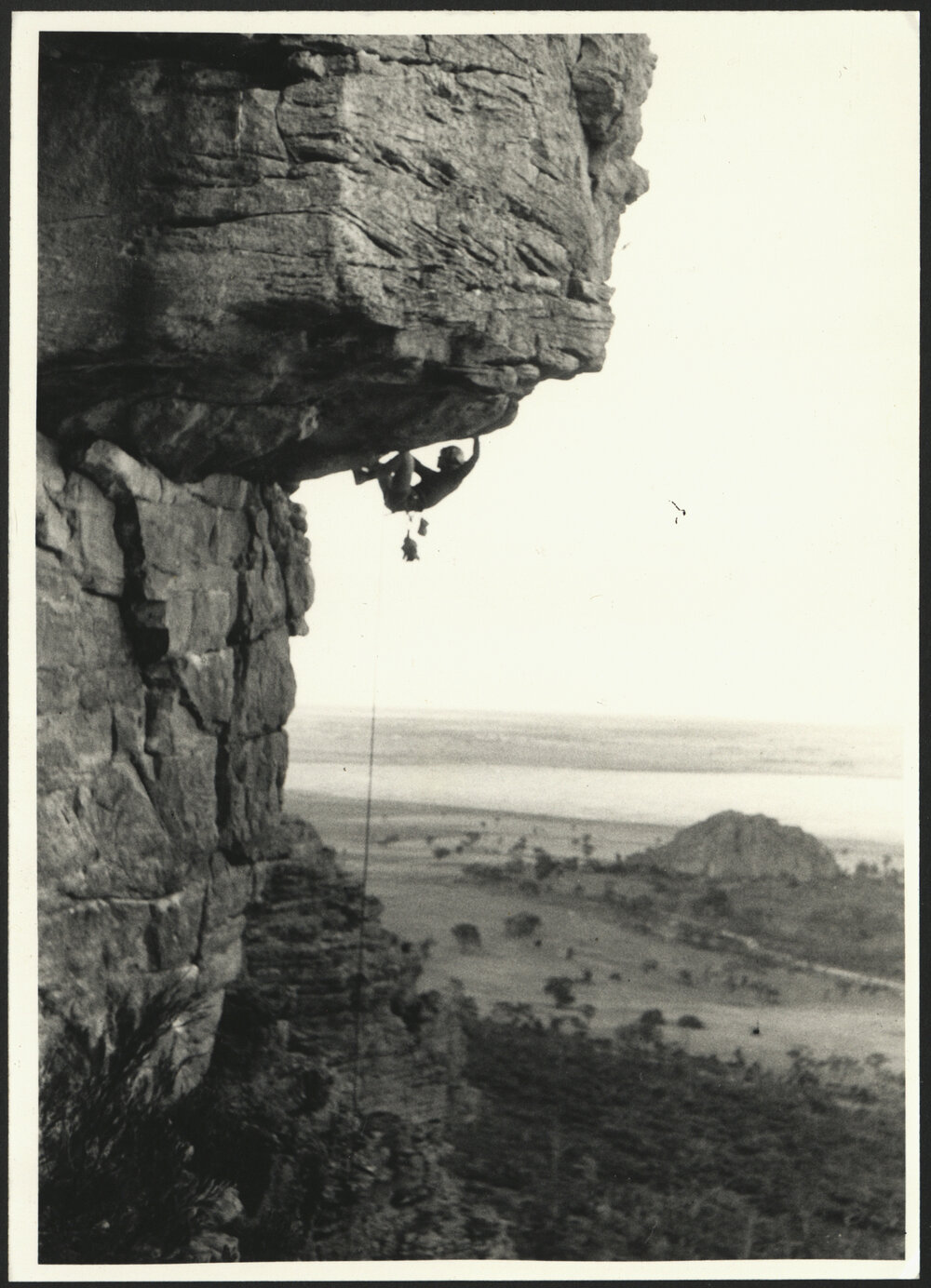 A Rock Climber Hanging off a Rock High on the Mountain - Climbing at Kachoong Mount Arapiles 