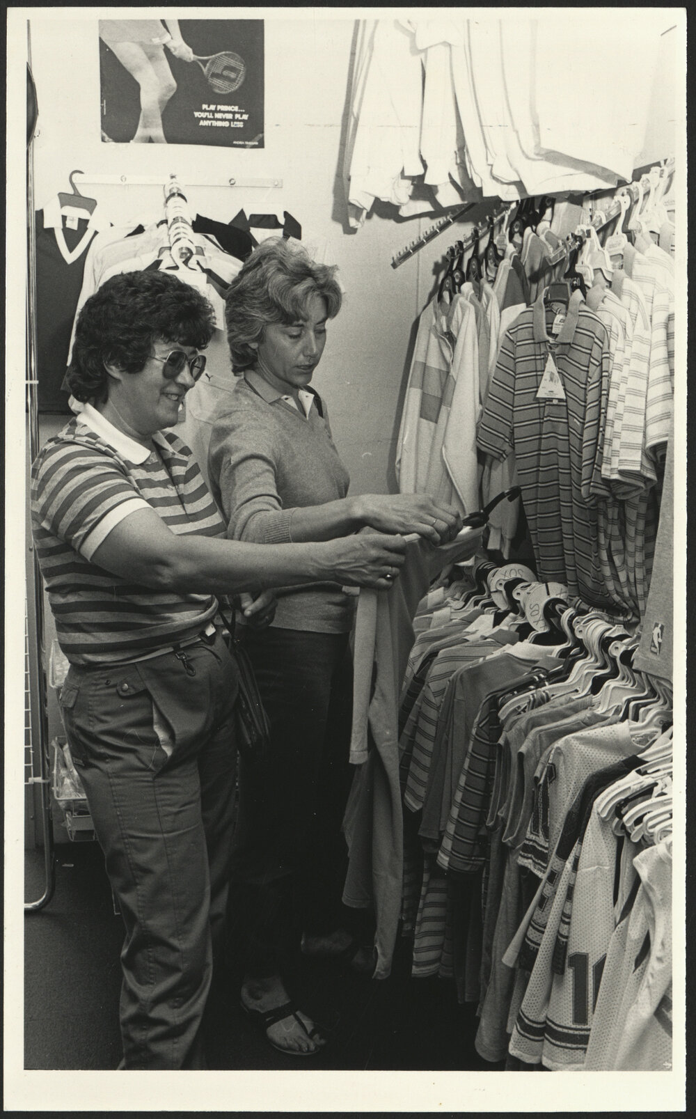 Two Women Looking at a Shirt in the Sports Store of the Sports Union