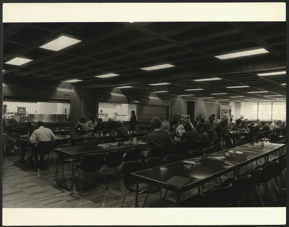Staff and Students Enjoy a Meal in the New Cafeteria Wentworth Building with Service Counters in the Background