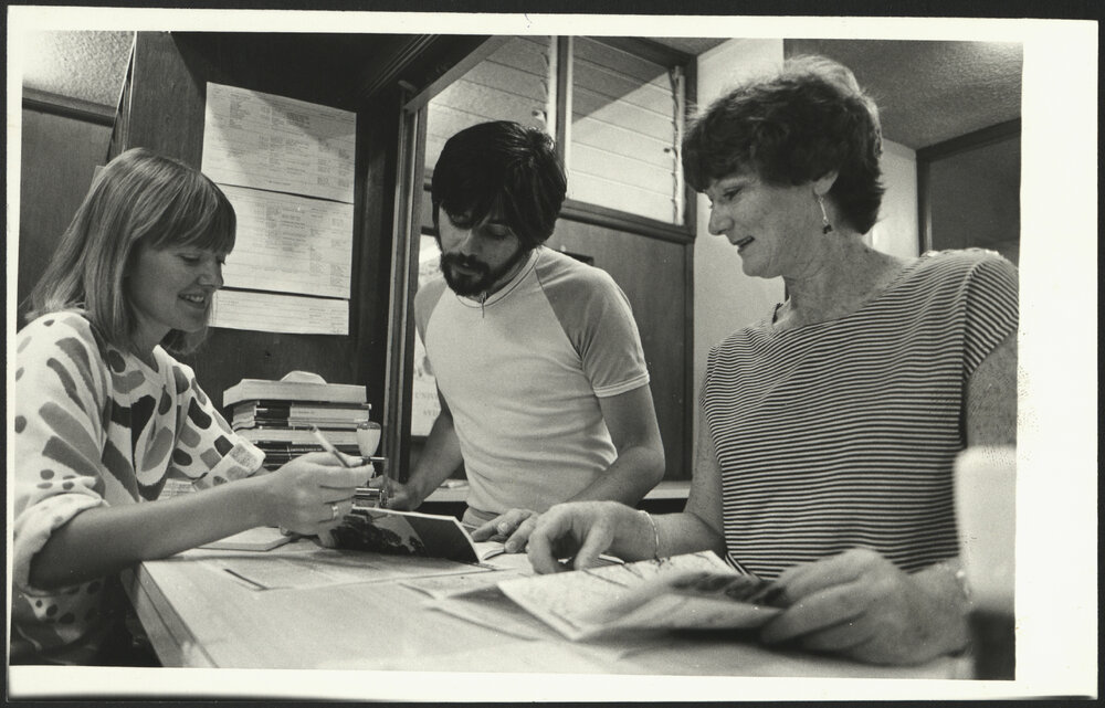 A Staff Member Assisting a Student at the Student Centre Enquiry Counter