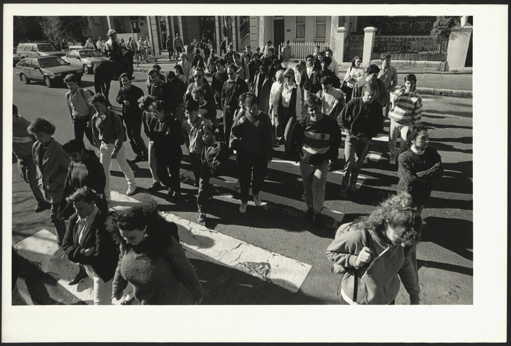 Student Foot Traffic to the University with a Policeman on Horseback in the Background(2)