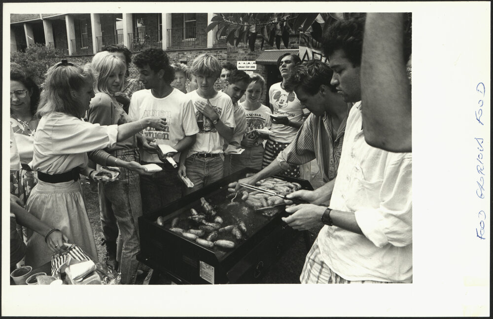 Students at the Barbeque Waiting for Sausages