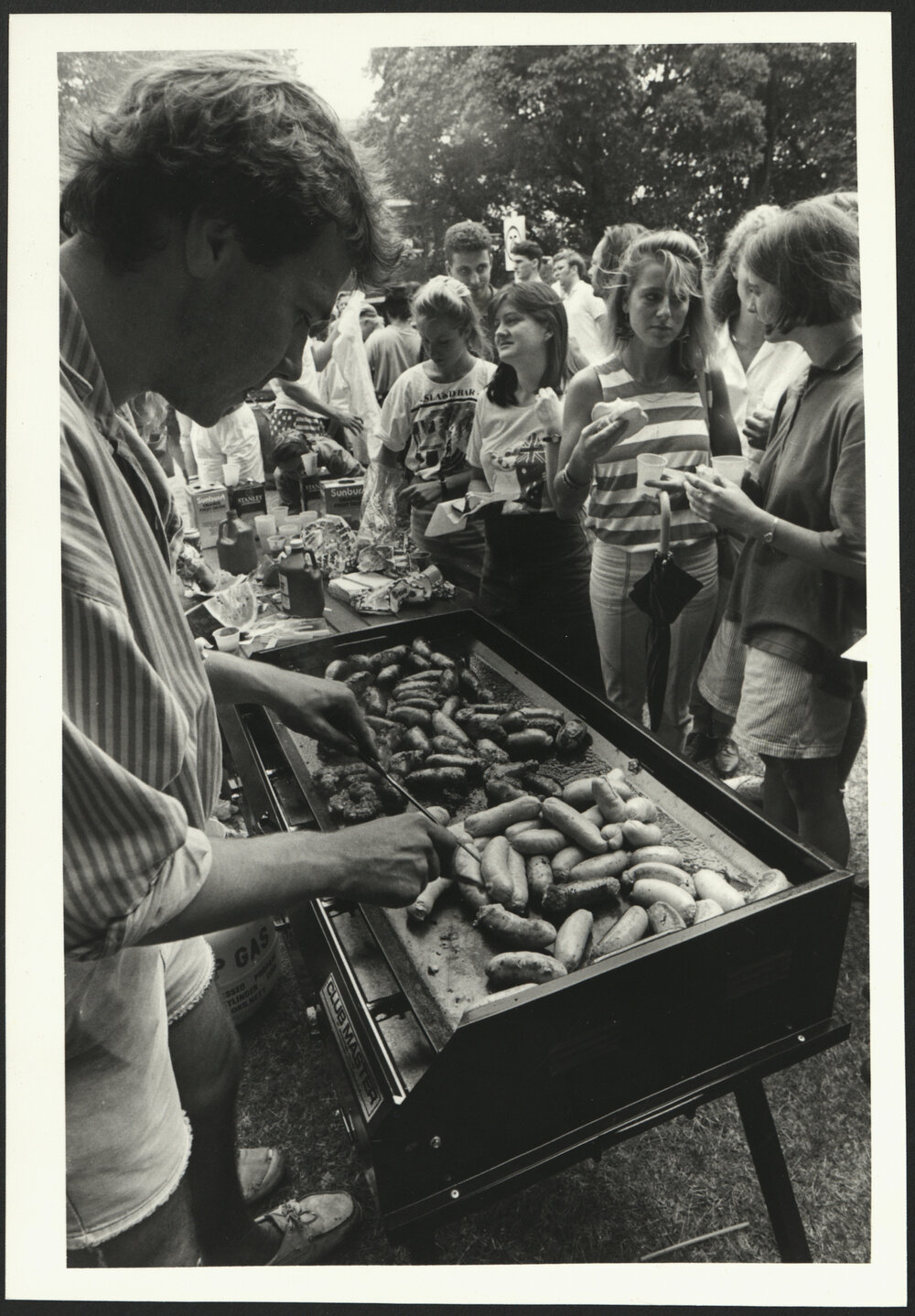 Students Queuing for Sausages at the Barbeque