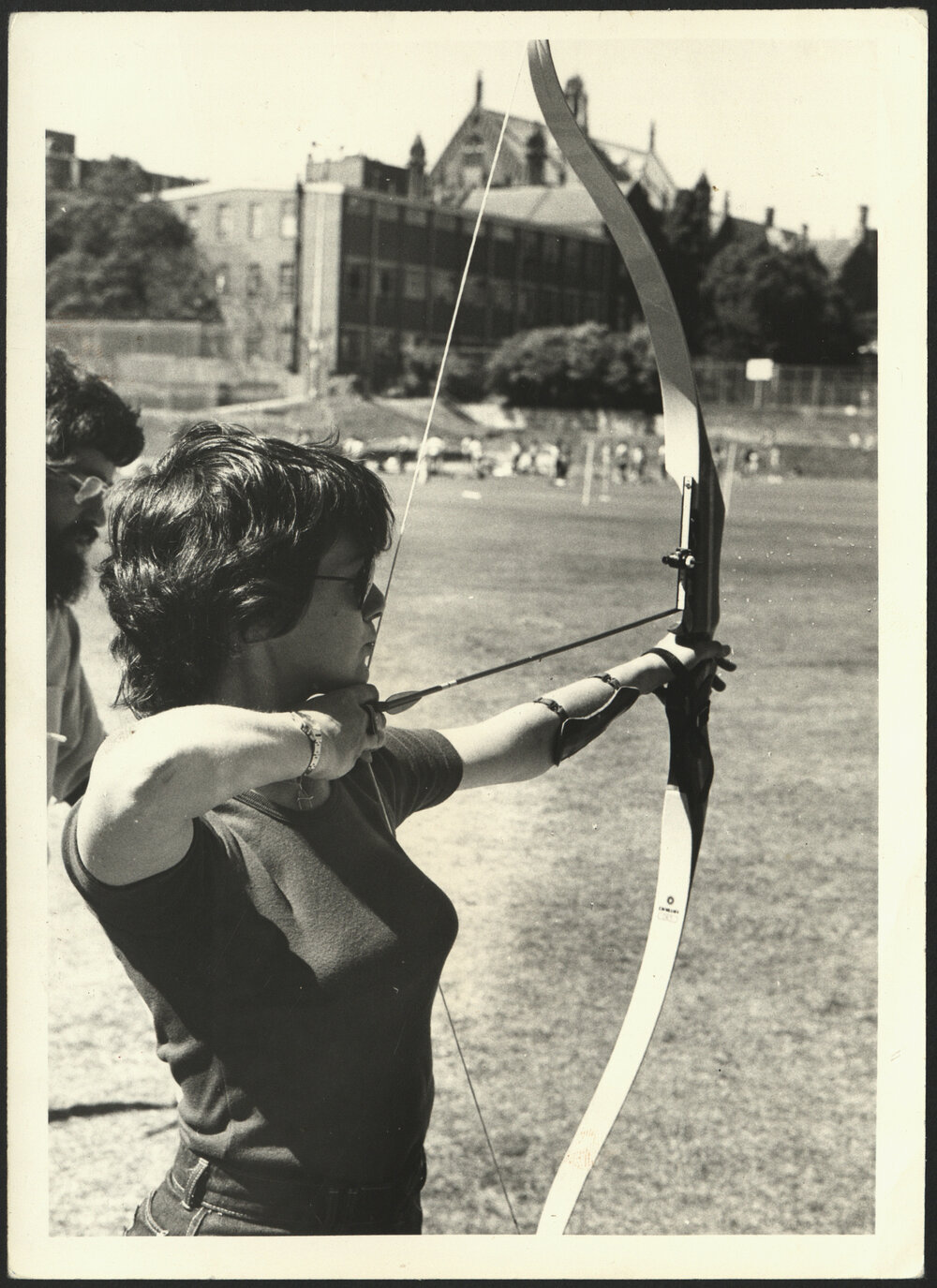 A Female Student Demonstrating Archery