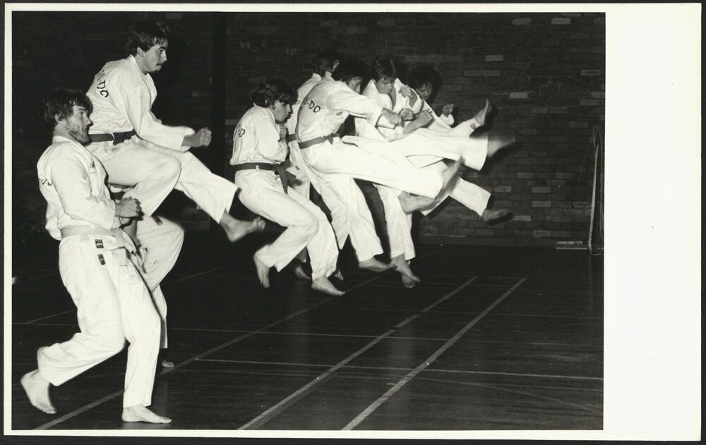 Students Practicing Jump and Kick During Martial Arts Class at the HK Ward Gymnasium