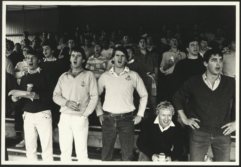 Spectators at the Intercollegiate Football St Paul's vs St John's Standing in the Stand and Singing