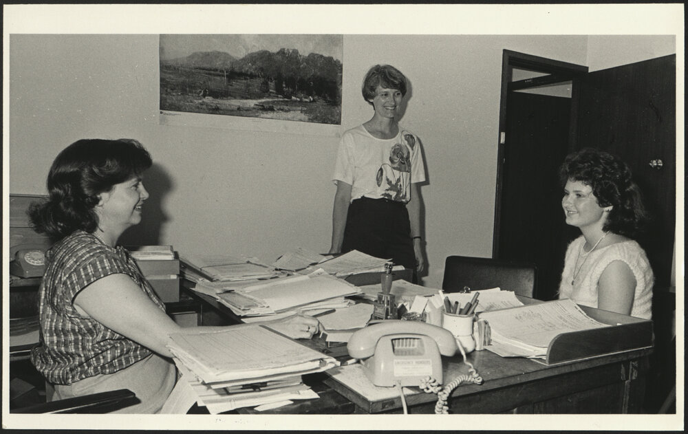Three Financial Assistance Section Staff Members in Their Office