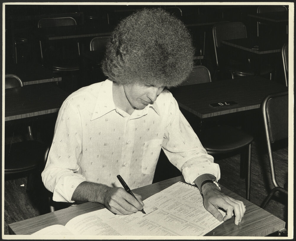 Mr O'Hare, Student Centre Admissions Officer, Completing an Enrolment Form