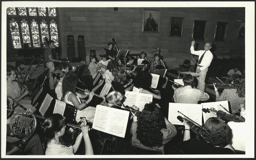 Peter Platt Conducting the Pro Musica Orchestra in the Great Hall