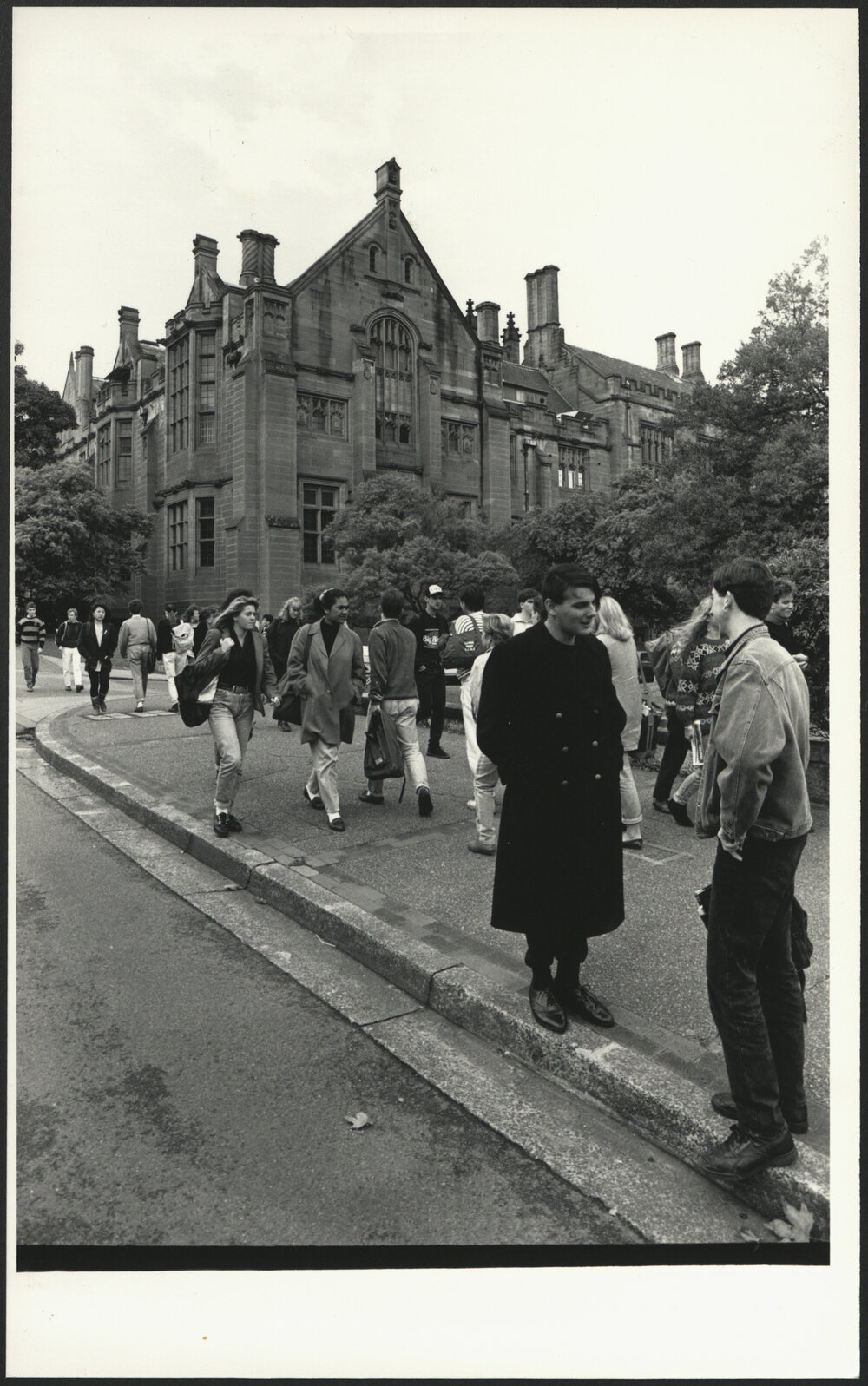Students Walking on Manning Road Two Students in Conversation at Front Right, Anderson Stuart Building in Background