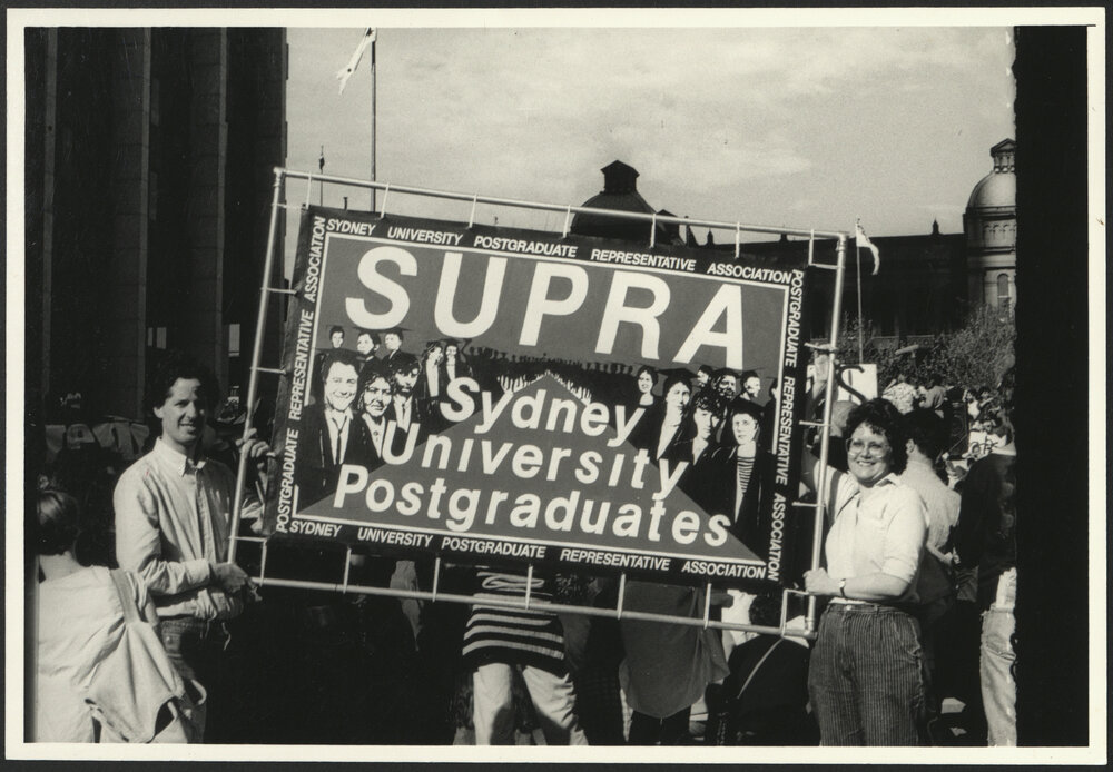 Students Holding SUPRA Banner