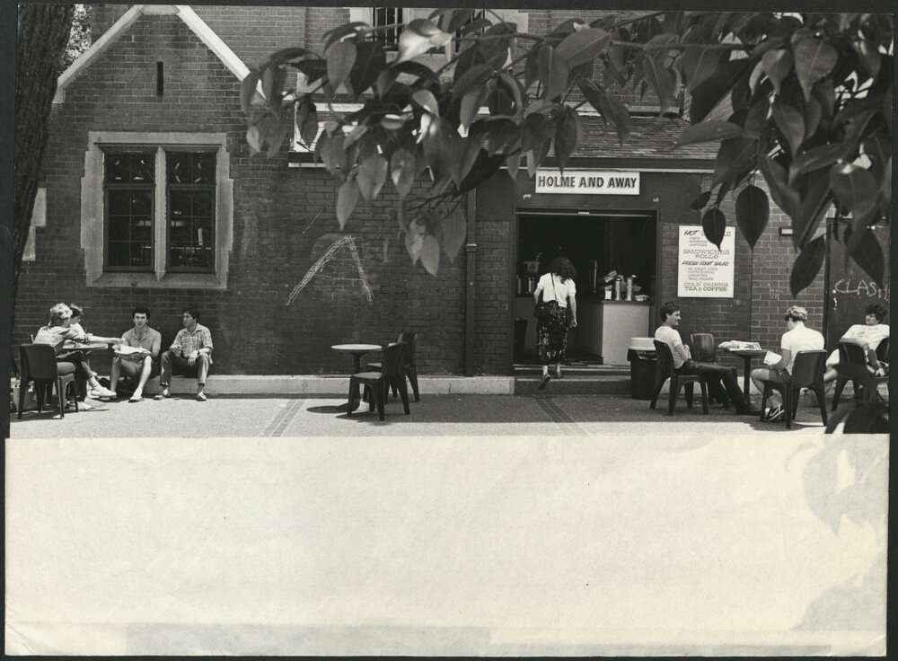 Students Sitting Outside at the 'Holme and Away Caf&eacute;'