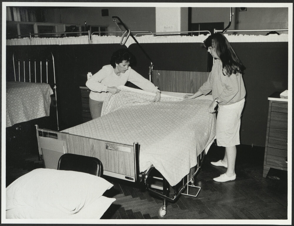 Faculty of Nursing - Practicing Nursing Skills Two Students Making a Bed