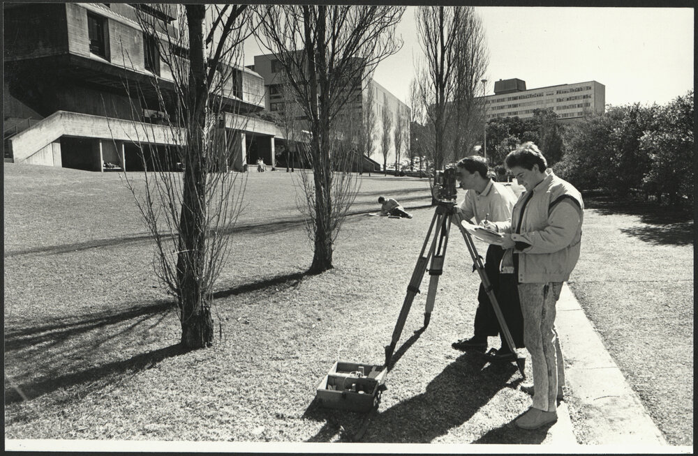 Engineering Students Surveying on University Campus