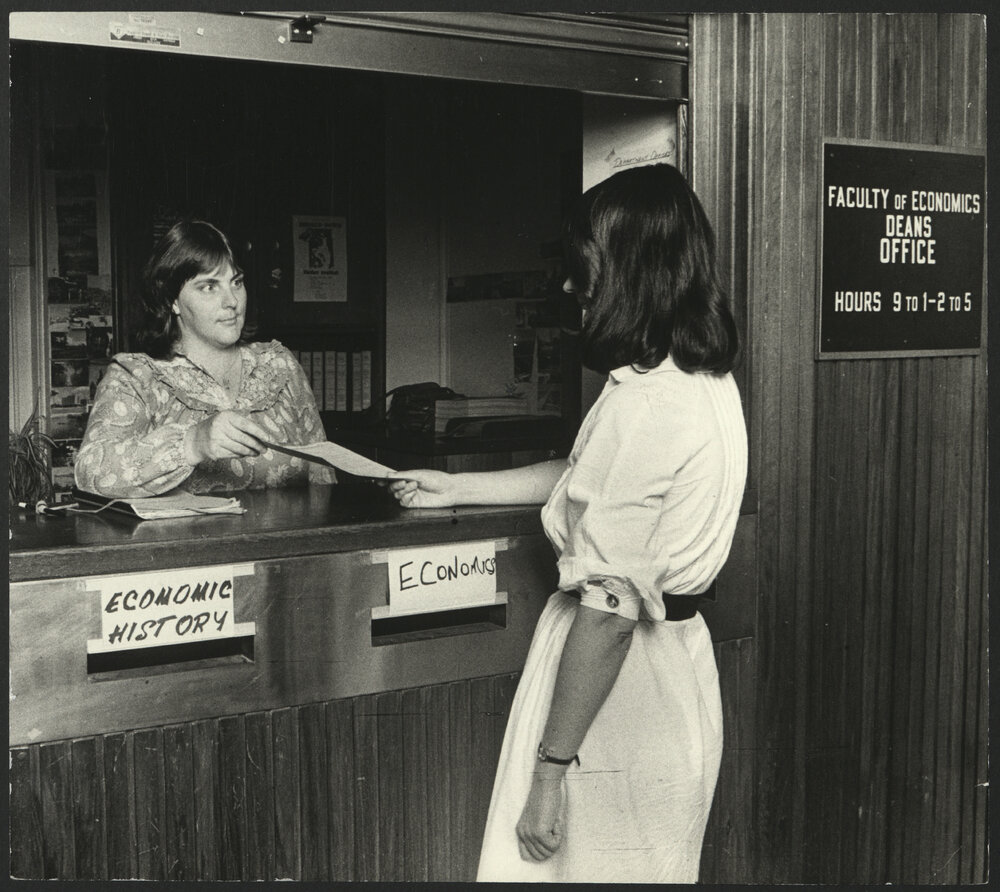 Staff Assisting with an Enquiry at the Faculty of Economics Office Counter