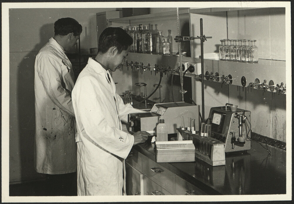 Pharmaceutical Chemistry Laboratory Two Students Standing at a Work Bench
