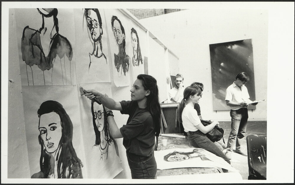 Students Hanging Artworks