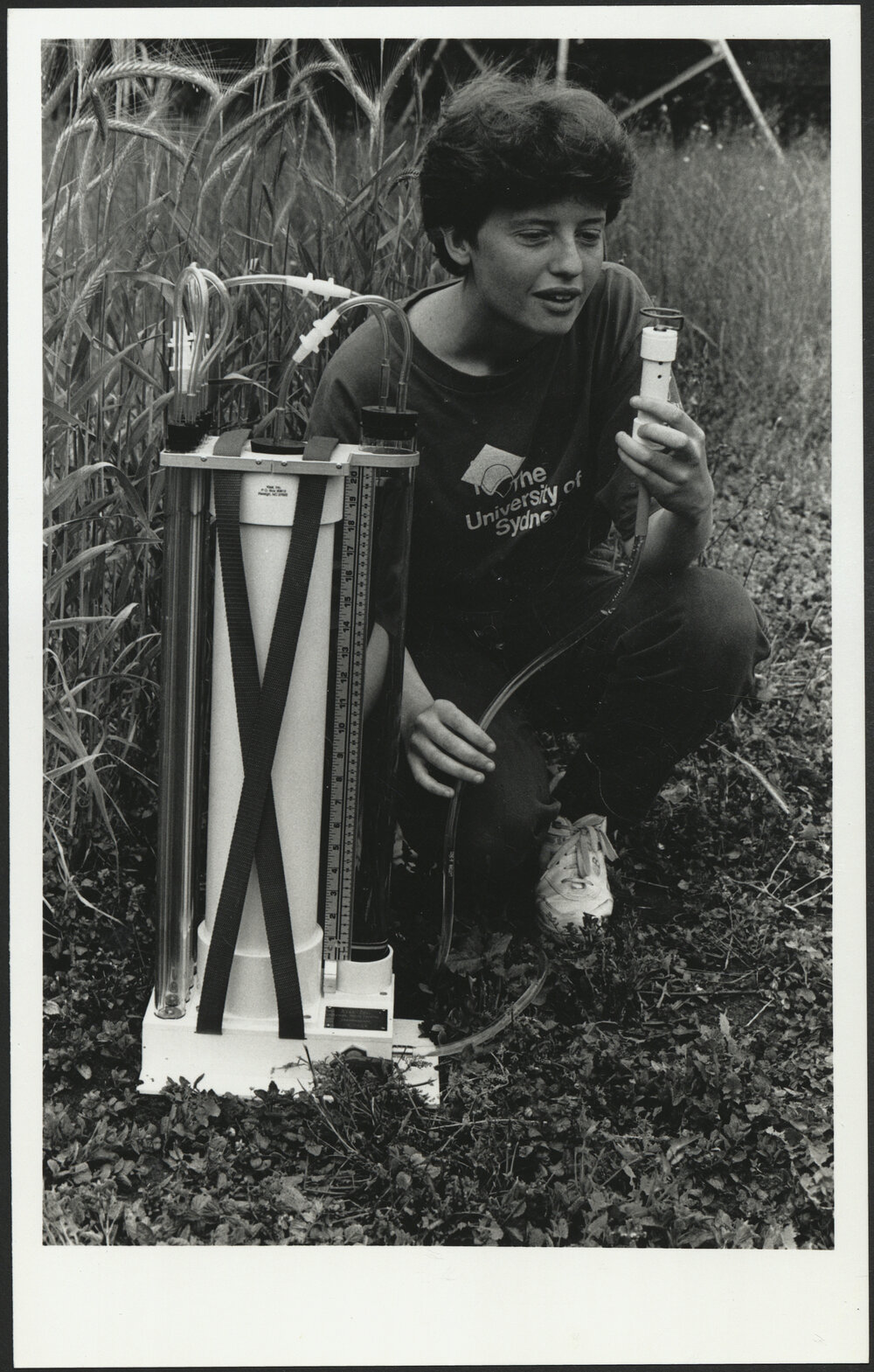 Agriculture Student in Wheat Field with Scientific Apparatus