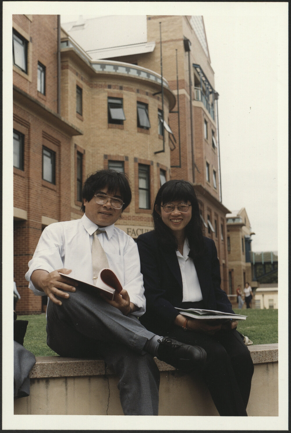 Vietnamese Masters Students Do Van Dung (L) and Nguyen Thi Tu Trang Outside the Education Building